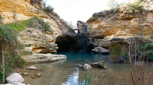the Salto del Usero nature reserve with eroded sandstone cliffs and colorful pools of water