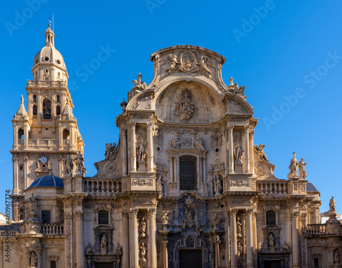 close up view of the historic cathedral in Murcia under a cloudless blue sky