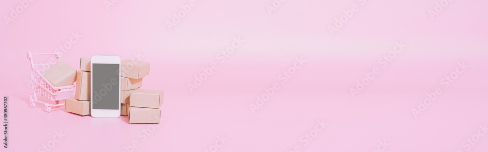 Business ecommerce and online shopping concepts from smartphone and product box order. web banner size. Business ecommerce and online shopping concepts from smartphone and product box order. web banner size.
