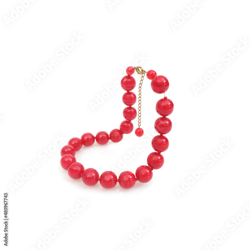 Red round beads isolated on white background