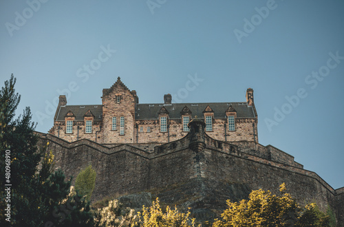Edinburgh Castle, a royal castle occupying a commanding position atop a volcanic crag with cliffs on three sides and the fourth side facing the capital city of Edinburgh