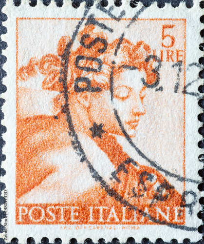 Italy - circa 1961: a postage stamp from Italy showing a work of Michelangelo: Head of 