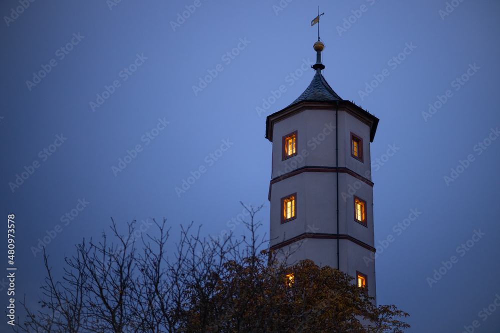 Stone Tower in the evening after sunset with enlightend windows