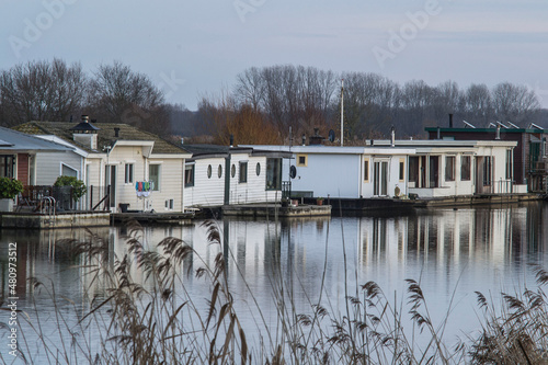 houseboats in river Oude IJssel on a winter's day © henkbouwers
