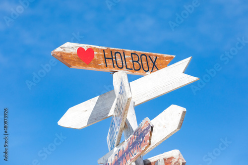 Isla Holbox sign in Mexico with a clear blue sky in the background photo