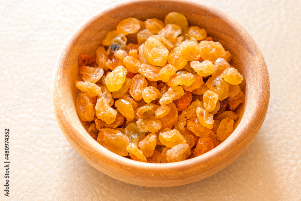 golden raisins close up in bowl golden raisins close up in bowl