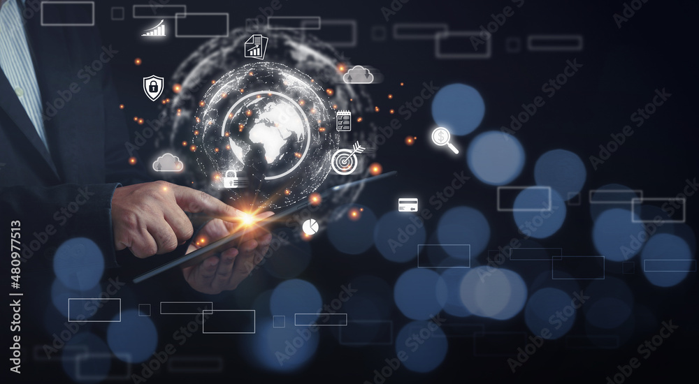Obraz premium Businessman touching tablet holding on hands the virtual world digital online. For providing access to information data, innovation and technology. Internet digital networking online, business.