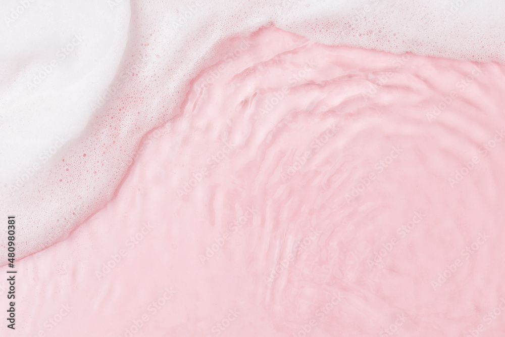 Top view of pink transparent clear calm water surface. Texture with splashes, foam and bubbles. Trendy abstract spring summer nature background for product. Flat lay cosmetic mockup Top view of pink transparent clear calm water surface. Texture with splashes, foam and bubbles. Trendy abstract spring summer nature background for product. Flat lay cosmetic mockup