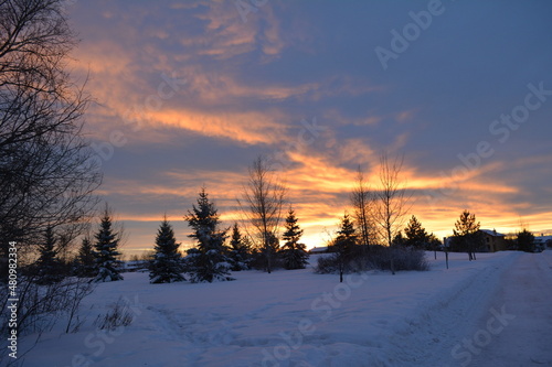 sunset over snowy park