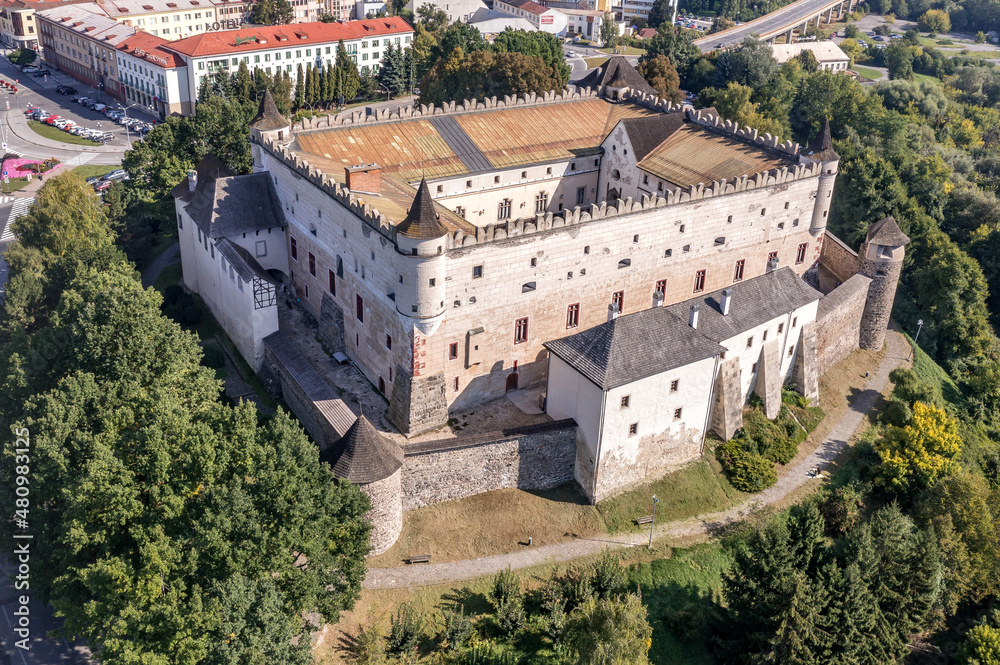 Aerial view of Zvolen castle in Slovakia with Renaissance palace, outer ring of wall, turrets, corner tower, massive gate tower, Gothic Chapel