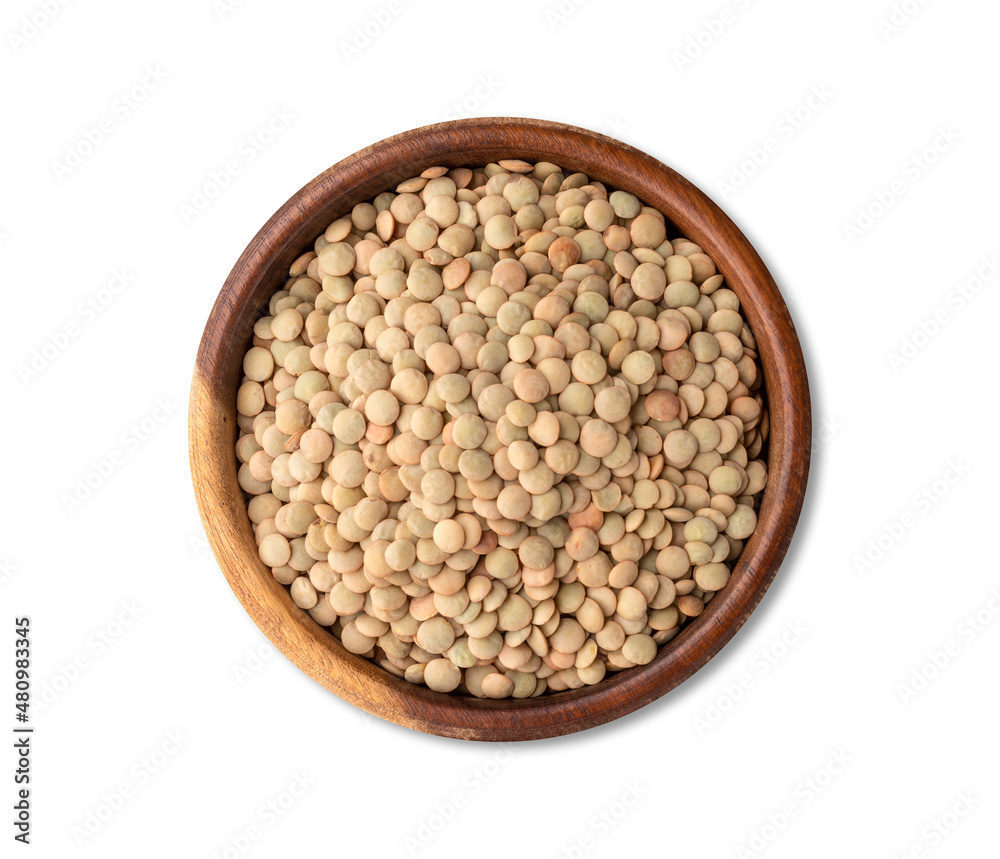 Raw lentils in a wooden bowl isolated over white background Raw lentils in a wooden bowl isolated over white background
