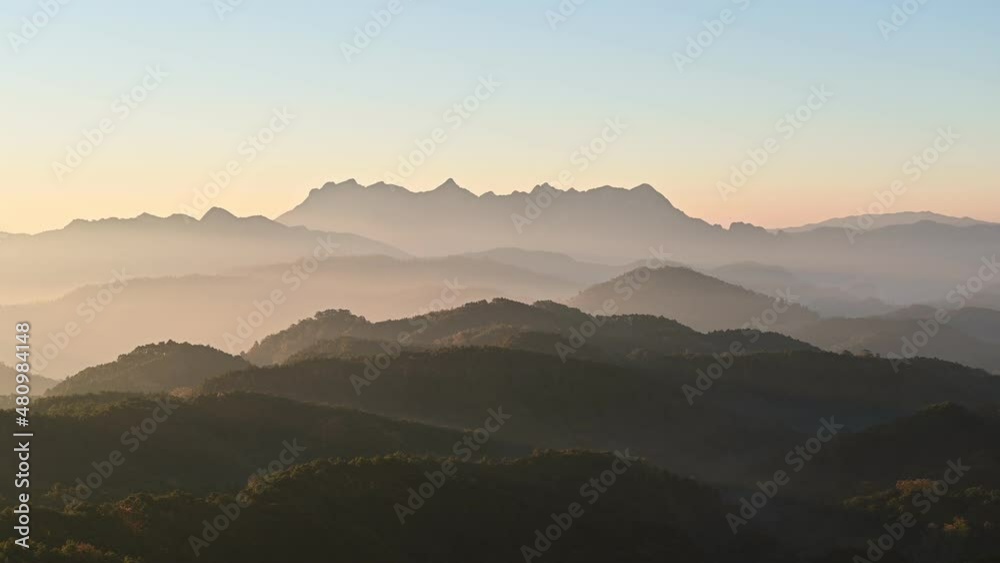 Scenery of Doi Kham Fah viewpoint with sunrise over Doi Luang Chiang Dao mountain with foggy in tropical rainforest at national park Scenery of Doi Kham Fah viewpoint with sunrise over Doi Luang Chiang Dao mountain with foggy in tropical rainforest at national park