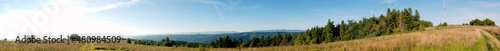 Panorama of the landscape with transmission towers and mountains in the background