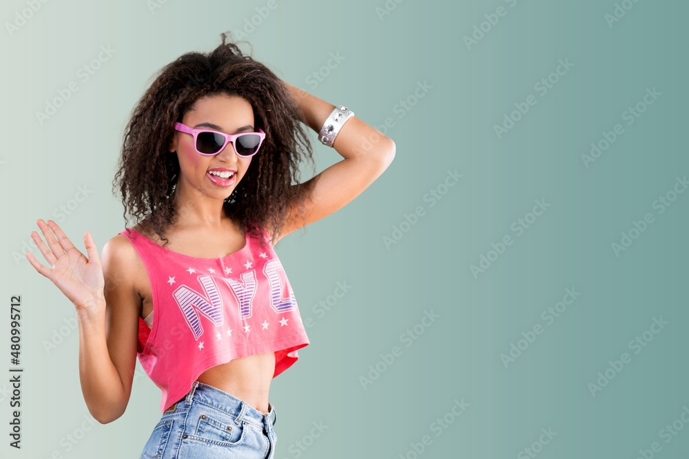 Fashion Woman in stylish clothes. Makeup curly Hair. Fashion model posing in studio Fashion Woman in stylish clothes. Makeup curly Hair. Fashion model posing in studio