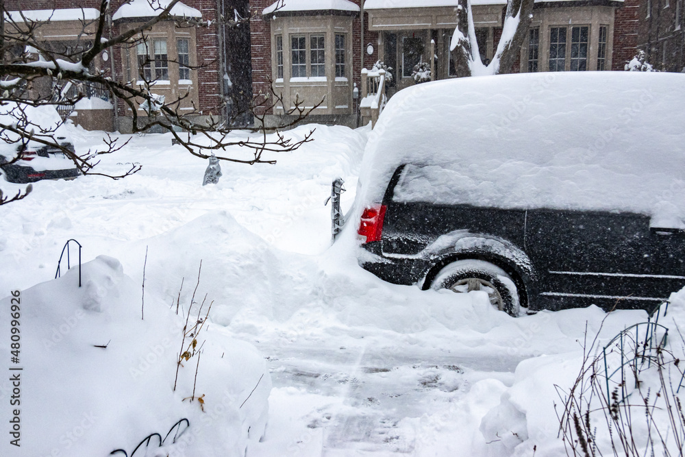 As a blizzard sweeps into a residential neighbourhood the streets fill with snow and residents start to shovel out their cars and sidewalks. Shot in Toronto’s Beaches neighbourhood in January. As a blizzard sweeps into a residential neighbourhood the streets fill with snow and residents start to shovel out their cars and sidewalks. Shot in Toronto’s Beaches neighbourhood in January.