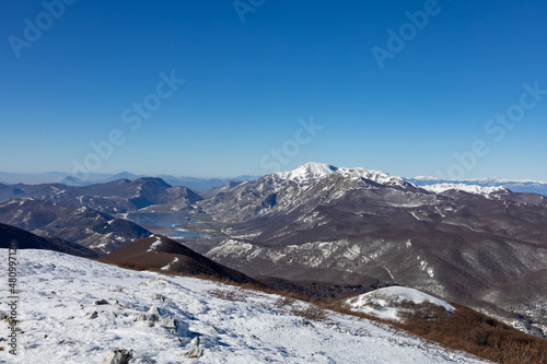 panorama of Matese lake, Monte Miletto and Monte Gallinola with snow. Matese National Park, Campania and Molise, Italy