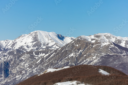 panorama of Monte Miletto and Monte Gallinola with snow, the highest peaks of the Matese massif. Matese National Park, Campania and Molise, Italy