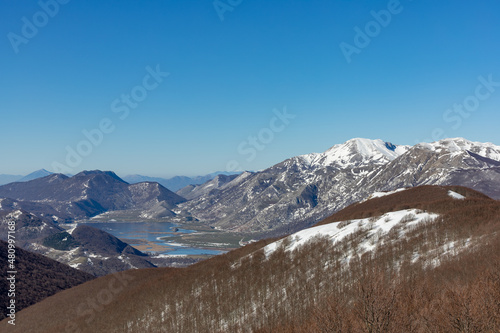 panorama of Matese lake, Monte Miletto and Monte Gallinola with snow. Matese National Park, Campania and Molise, Italy photo
