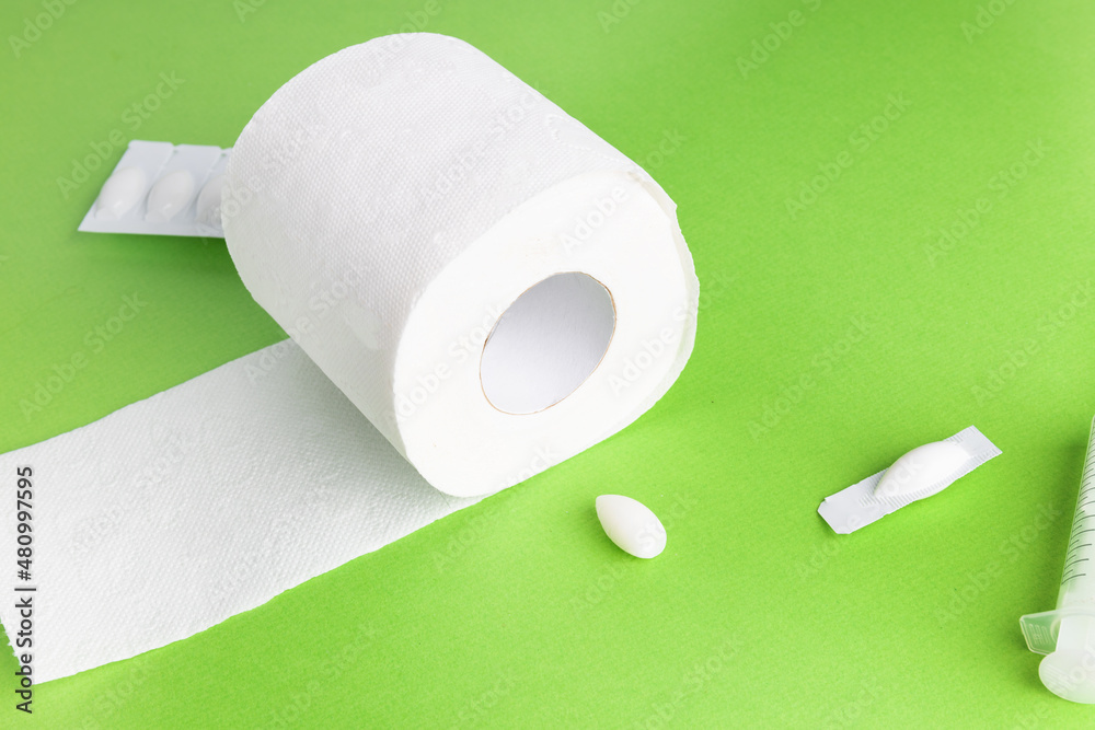 Toilet paper and rectal suppositories on a bright background with copy space Stock Photo Adobe