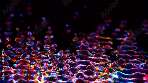 Awesome bg with magic particles float in liquid, light rays like laser show, light effects and bokeh, DOF. Glowing multi-colored particles circle underwater forming cloud. Luma matte as alpha channel. photo