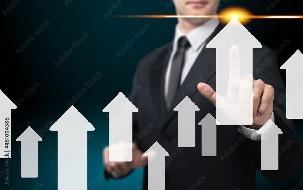 Businessman touching rise up arrow for business and profit growth concept. Businessman touching rise up arrow for business and profit growth concept.