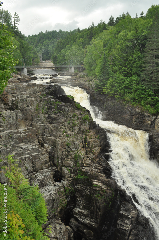 Waterfall in the forest crashing down between the rocks Waterfall in the forest crashing down between the rocks