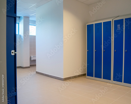 Close-up and general view of new metal lockers in a warehouse locker room