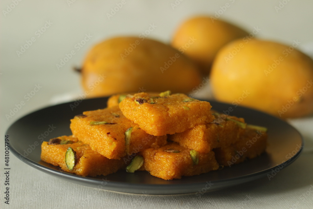 Mango fudge or Mango barfi or Mango kalakand. A mango version of Indian sweet dish Kalakand. Mango fudge or Mango barfi or Mango kalakand. A mango version of Indian sweet dish Kalakand.