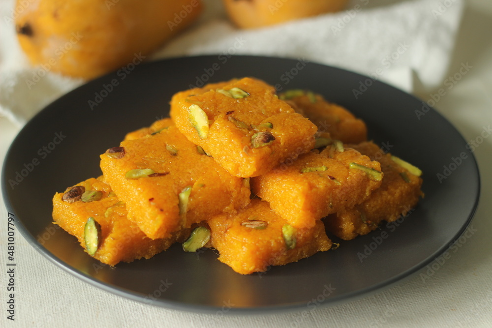 Mango fudge or Mango barfi or Mango kalakand. A mango version of Indian sweet dish Kalakand. Mango fudge or Mango barfi or Mango kalakand. A mango version of Indian sweet dish Kalakand.