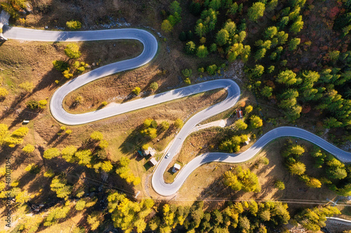 Natural landscape from air. Aerial view on the road and forest at the autumn ...