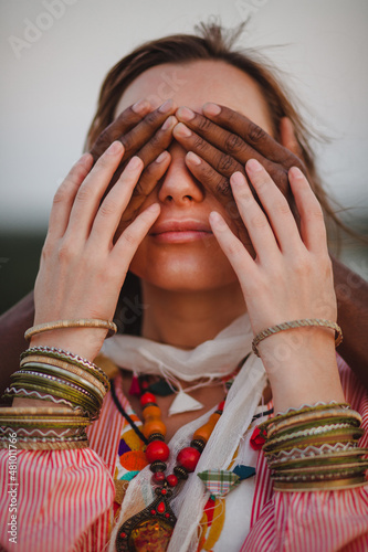 beautiful woman closes her eyes by her boyfriend
