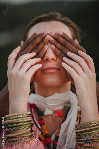 beautiful woman closes her eyes by her boyfriend
