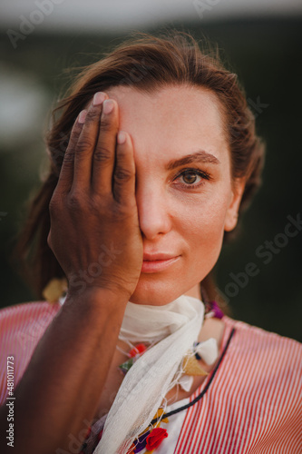 beautiful woman closes her eyes by her boyfriend
