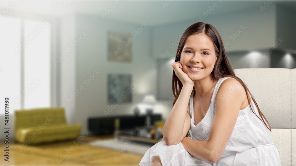 Happy satisfied young woman relaxing at home. Successful woman Happy satisfied young woman relaxing at home. Successful woman