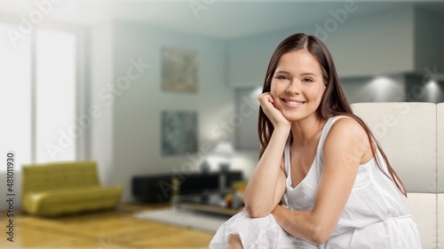 Happy satisfied young woman relaxing at home. Successful woman Free Download Happy satisfied young woman relaxing at home. Successful woman - GFXLoad