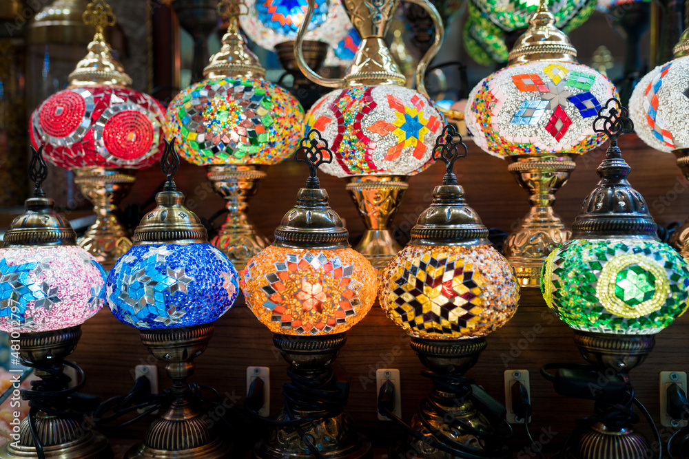 Colourful and ornamental Turkish lamps at the Grand Bazaar, Istanbul. Glass items, small hanging lamps, vase-like desk lamps in different colours on display at local store
