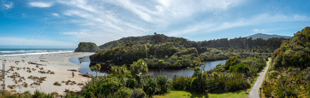 Scenic panorama landscape with beach and forest in New Zealand Scenic panorama landscape with beach and forest in New Zealand