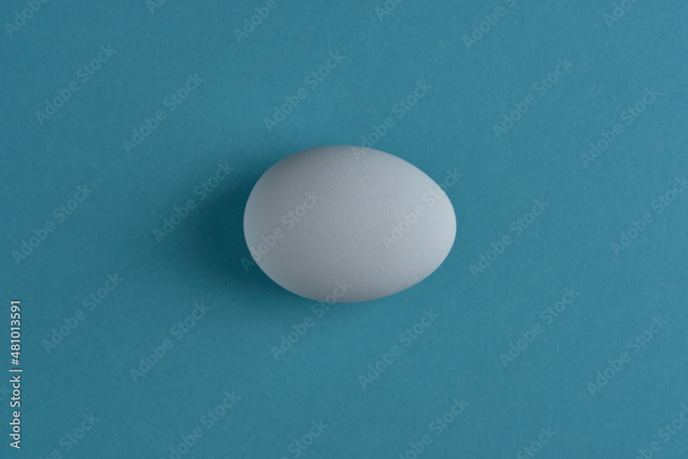 natural white eggs on a blue and yellow background natural white eggs on a blue and yellow background