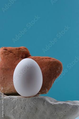 natural white eggs on a blue and yellow background