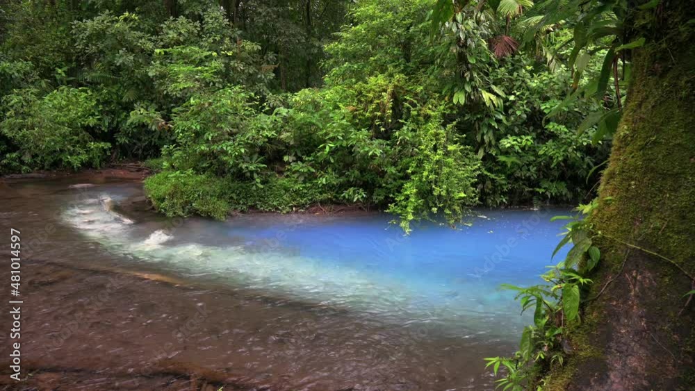 at the confluence of two rivers the blue river Rio Celeste is formed ...