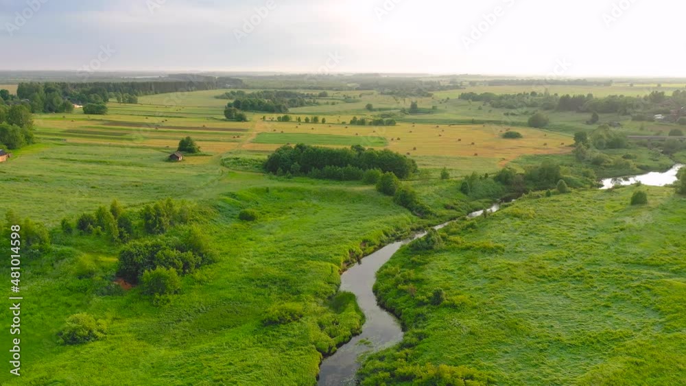 Aerial drone view of winding river in greenfield. Lush wetlands of bird's eye view. Discover the beauty of earth Aerial drone view of winding river in greenfield. Lush wetlands of bird's eye view. Discover the beauty of earth