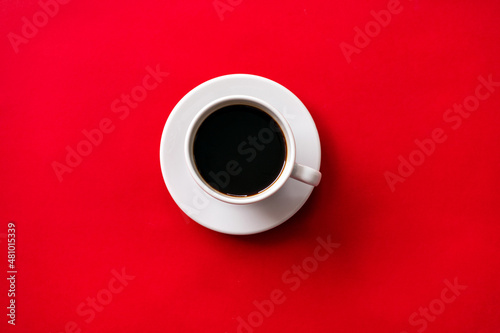 cup of coffee on red background. soft focus.