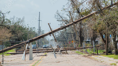 Canvas Print Close up of power lines and telephone poles down after a hurricane