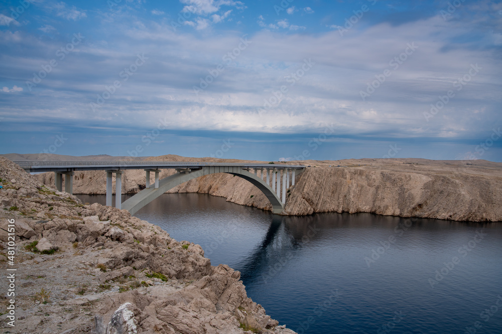 Bridge to the Croatian island of Pag, blue summer sky Bridge to the Croatian island of Pag, blue summer sky