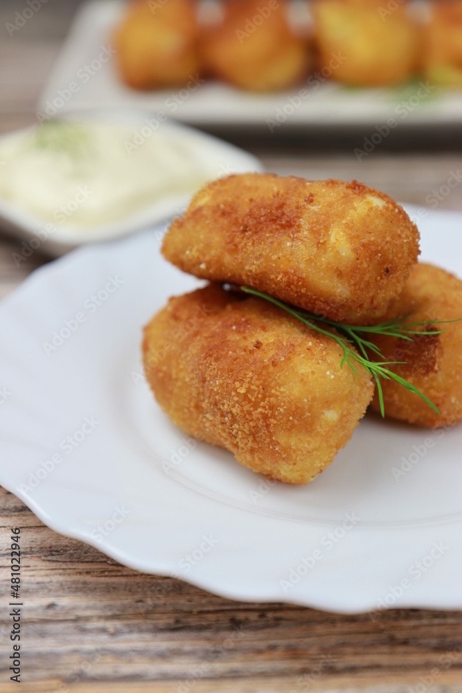 Close up of homemade croquettes, typical spanish dish.