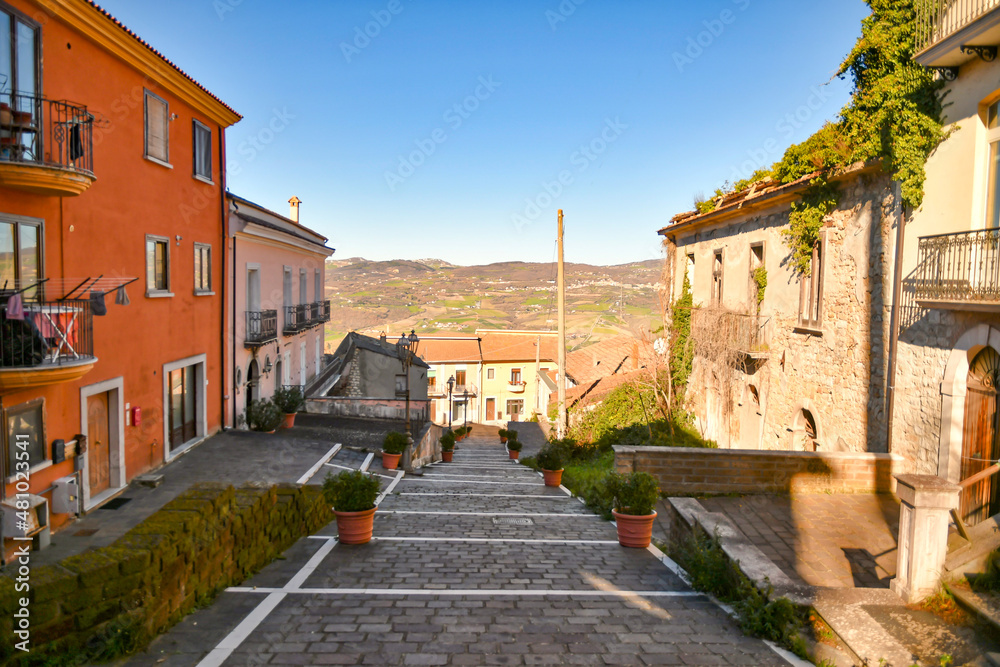 A street among the characteristic houses of Montecalvo Irpino, a village in the mountains in the province of Avellino, Italy.