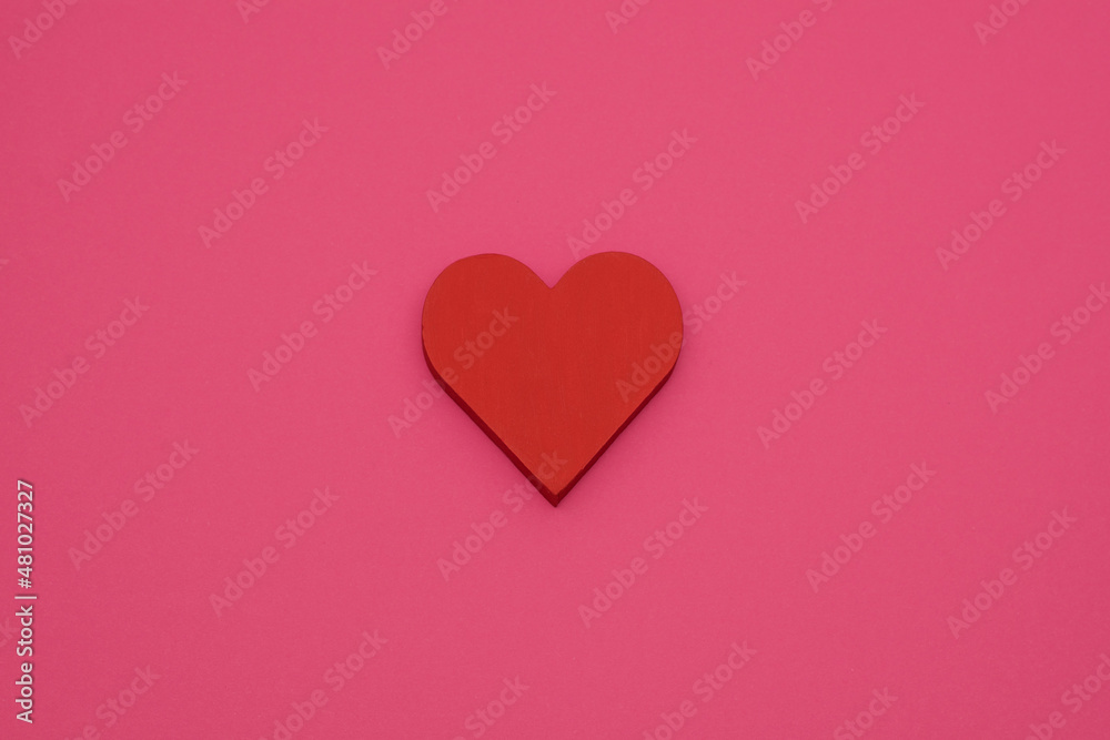 red heart on a pink background top view, card for valentine's day, birthday