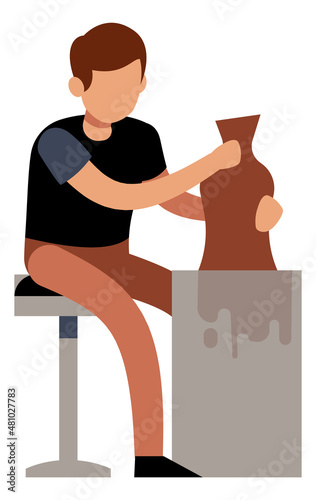 Man making pottery. Guy working with raw clay