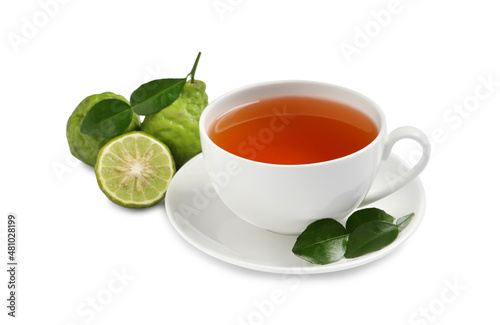 Cup of tasty bergamot tea and fresh fruits on white background