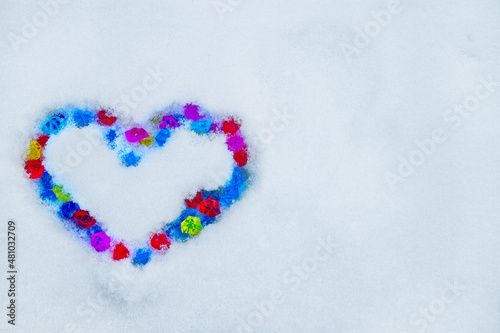 Heart made of crystalls on snow photo